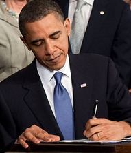 Obama_signs_health_care-crop